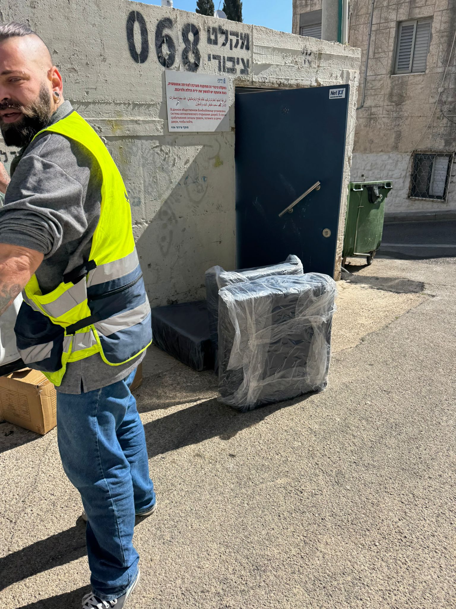 Delivering mattresses to a public bomb shelter during the war